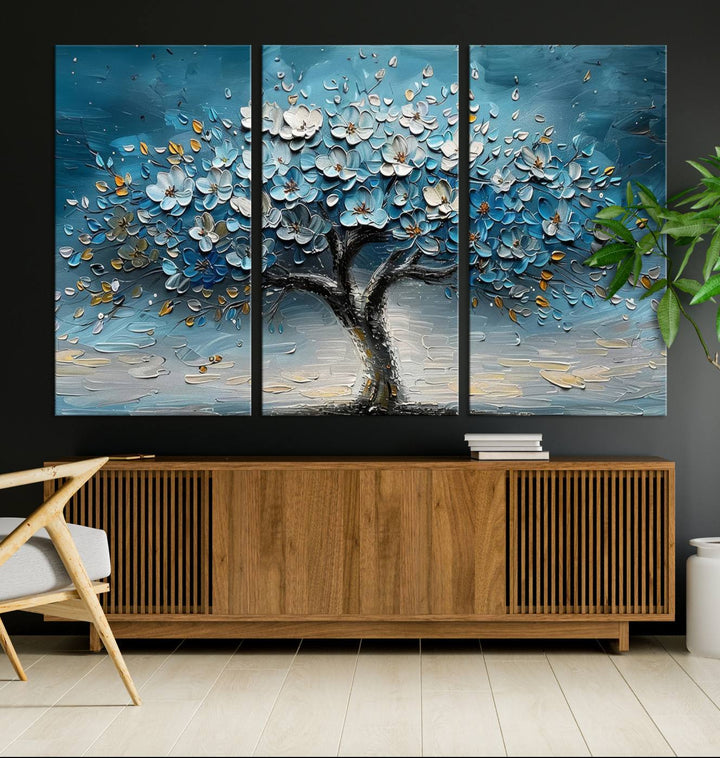 Abstract Blooming Tree Wall Art Print features blue, white, and gold textures on museum-quality canvas, perfect for modern decor.