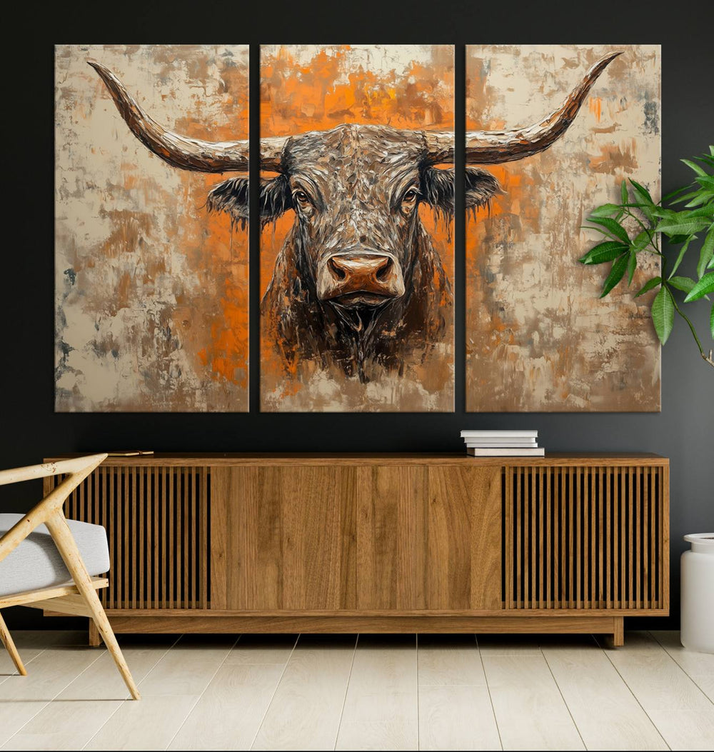 Abstract Cow Longhorn Bull Wall Art presents a detailed face centered on a textured orange and beige background.