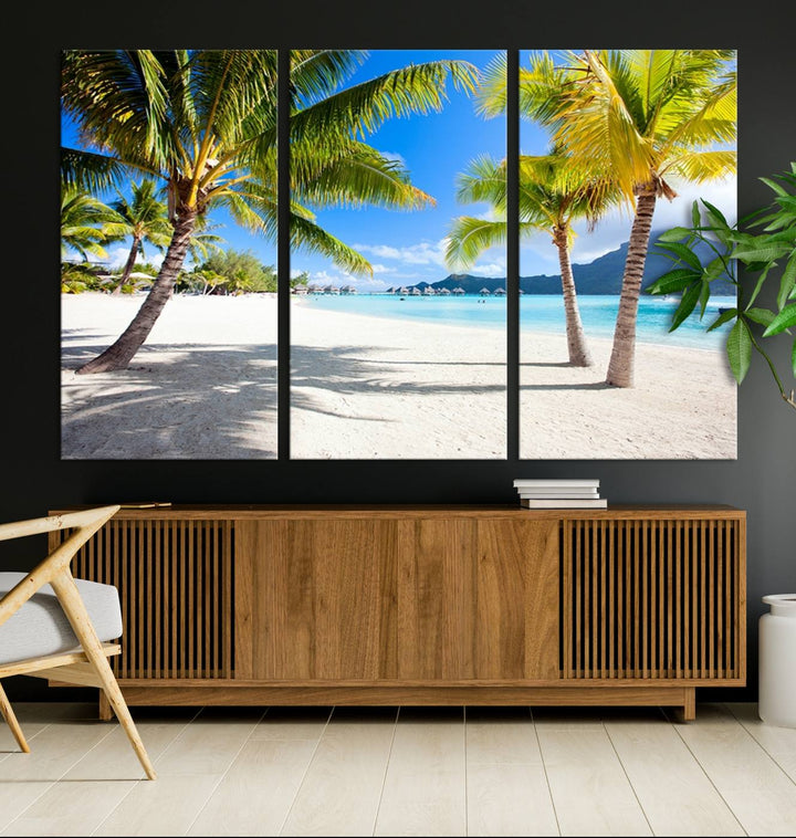 Blue Beach and Sea Wall Art Canvas Print: showcases a tropical scene with palm trees, white sand, and turquoise water.