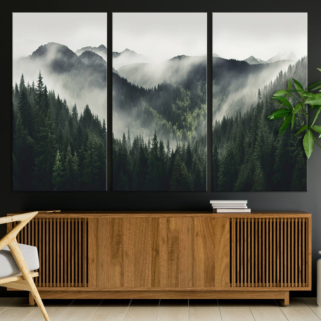 The Misty Forest Canvas Print Wall Art captures a serene misty forest scene with fog and mountains.