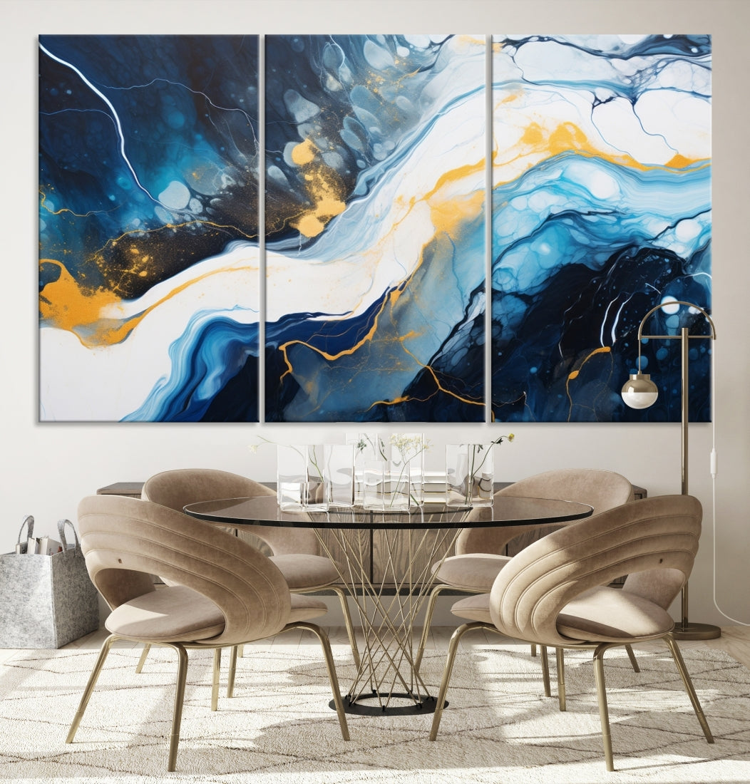 The Navy Blue Abstract Wall Art Canvas Print, displaying an exquisite array of blue, white, and gold swirls, is crafted on museum-quality canvas and enhances the space with its sophisticated elegance.