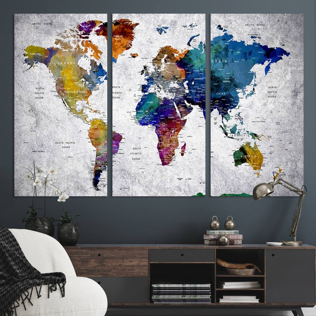 The World Map Art Canvas Print, featuring country names on a grunge-stained gray background, is perfect for stylish home decor.