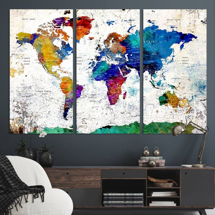 The wall art features the Colorful Abstract World Map – a vibrant contemporary triptych map print.