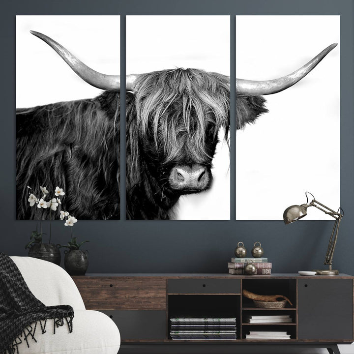 The Black and White Highland Cow Multi Panel Wall Art Canvas Print with UV-protection hangs prominently.