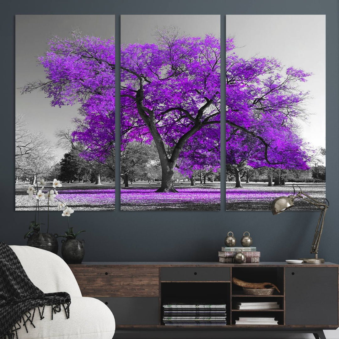 The Big Purple Tree Wall Art Canvas Print showcases a vibrant purple tree set against a black-and-white landscape.