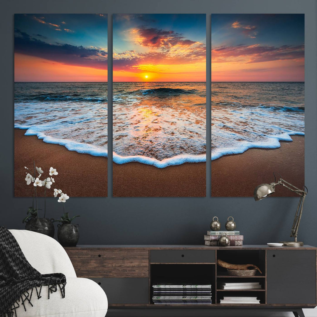 A Sunset with Calm Waves on the Beach Wall Art Canvas Print adorns the dining room.