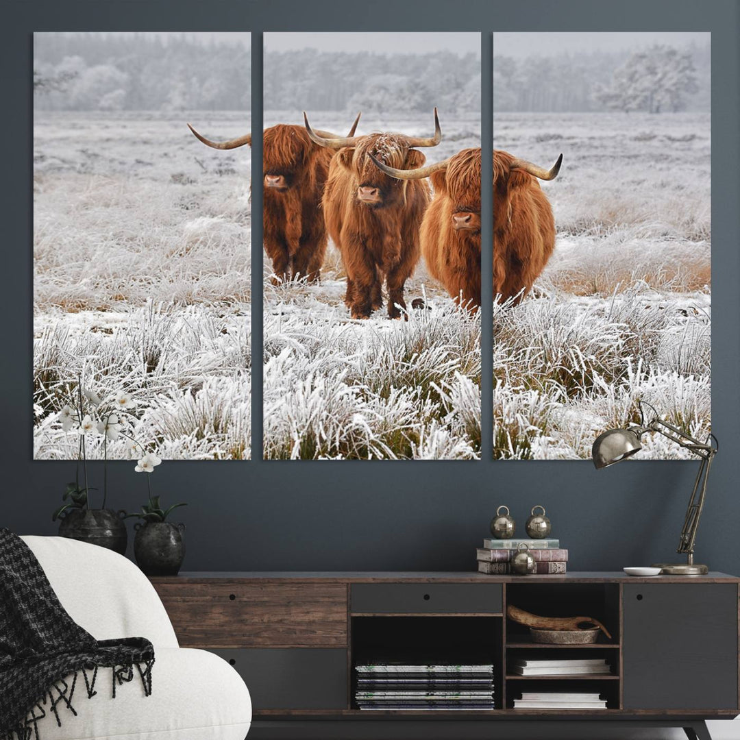 The Highland Cows in Snow canvas showcases three cattle in a frosty field.