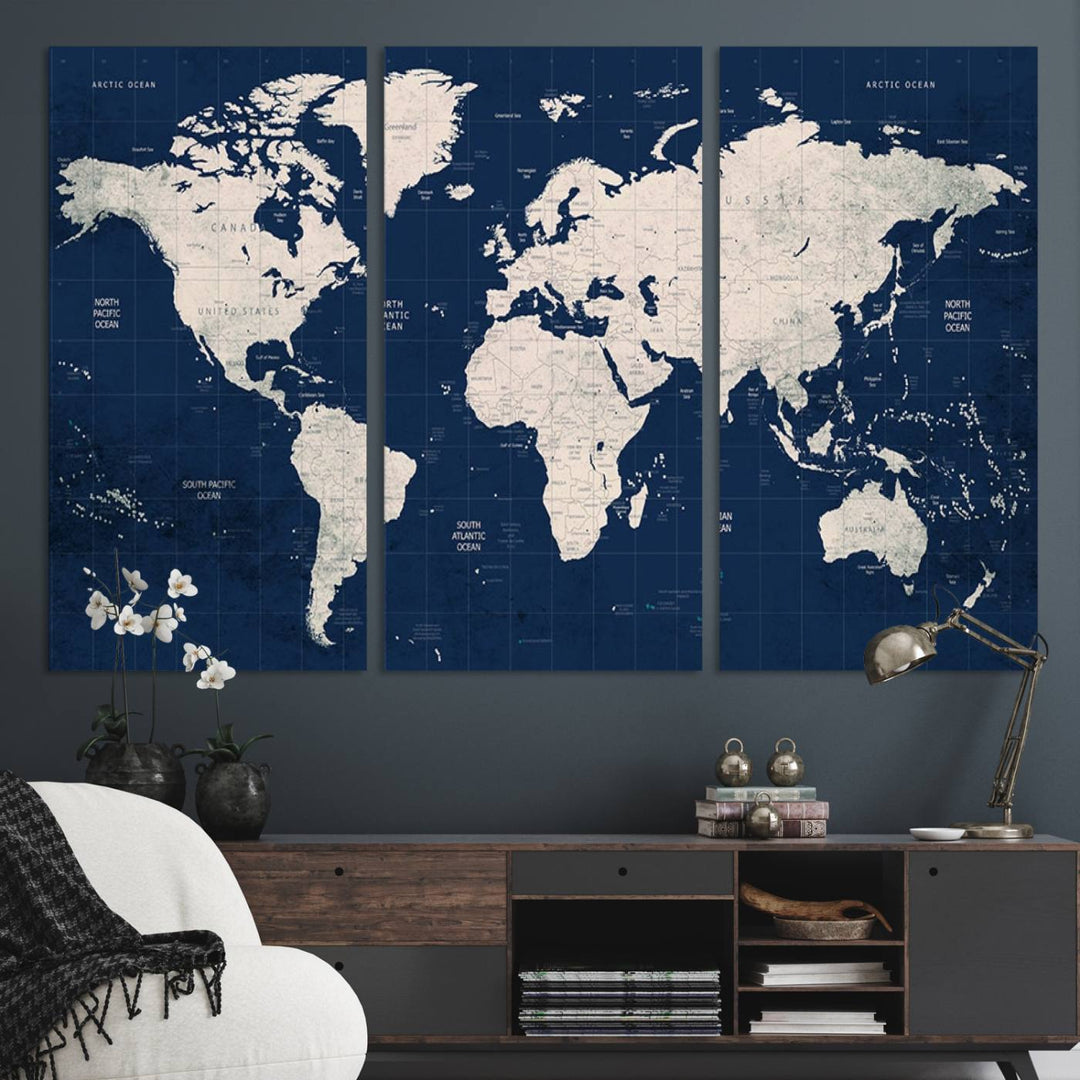 Large modern world map wall art canvas print in beige and navy; showcases a 3-panel vintage map design and is ready to hang.