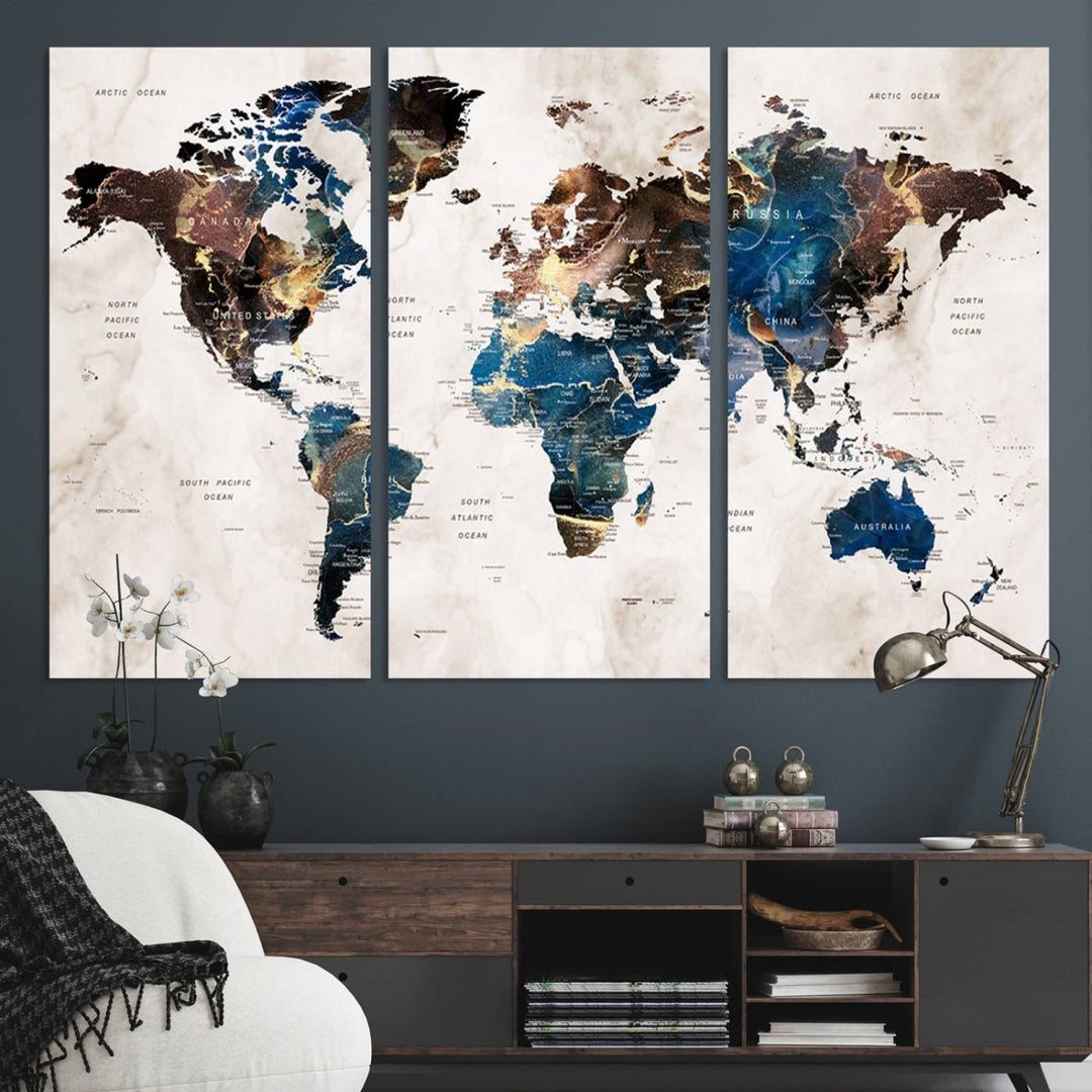 Abstract earth-toned 3-panel world map wall art featuring blues and browns, ready to hang; it showcases continents on modern canvas.