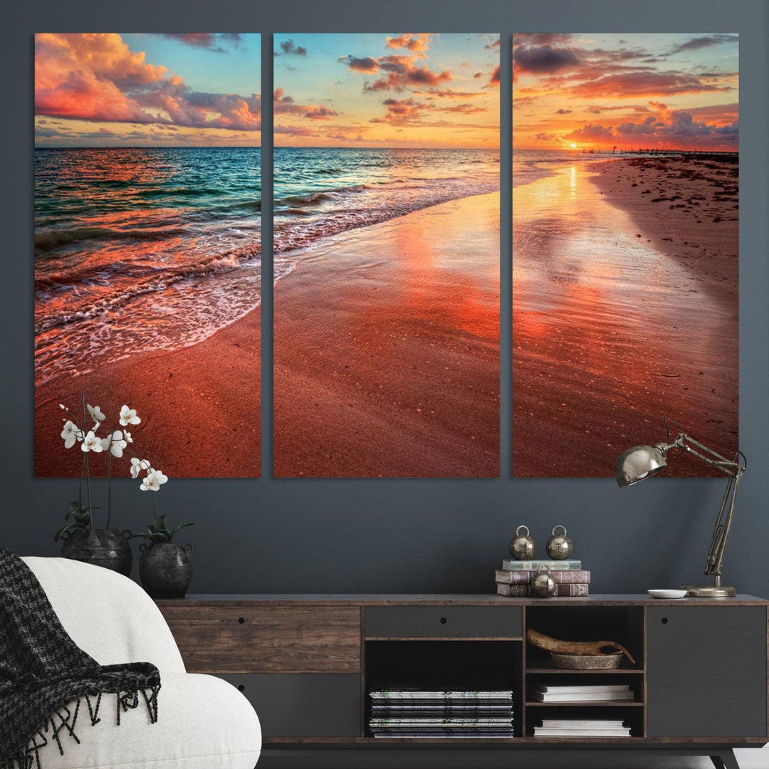 A Vibrant Sunset Beach Canvas Print with ocean waves and sandy shoreline enhances coastal-themed interiors.