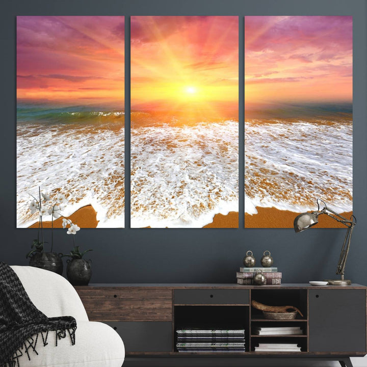 Golden Beach Sunrise 3-panel canvas art of ocean waves, hung on a wooden wall.