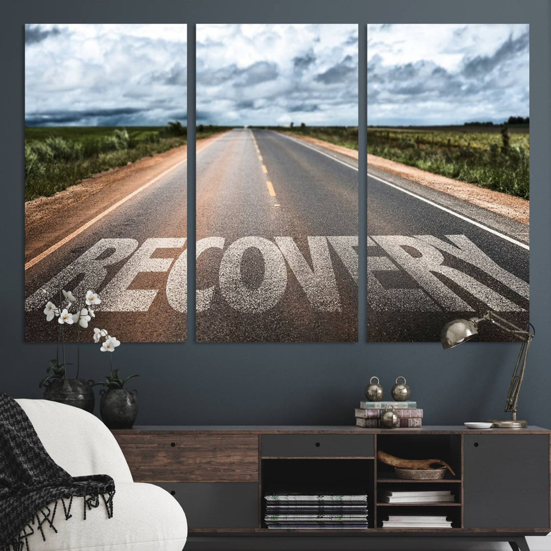 The Recovery Road Wall Art Canvas Print depicts a road under a cloudy horizon.