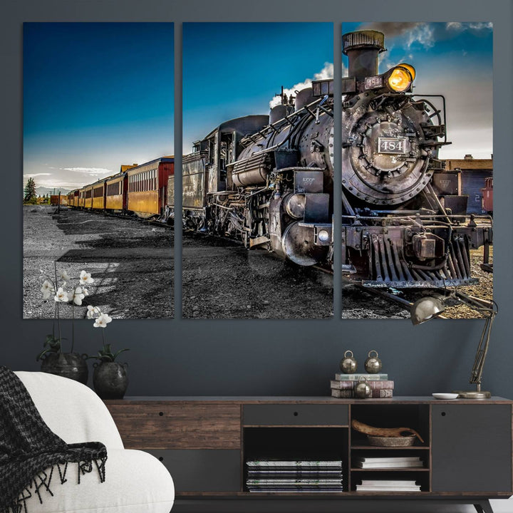 The Train Wall Art Canvas Print features a vintage steam train with a bright headlight.