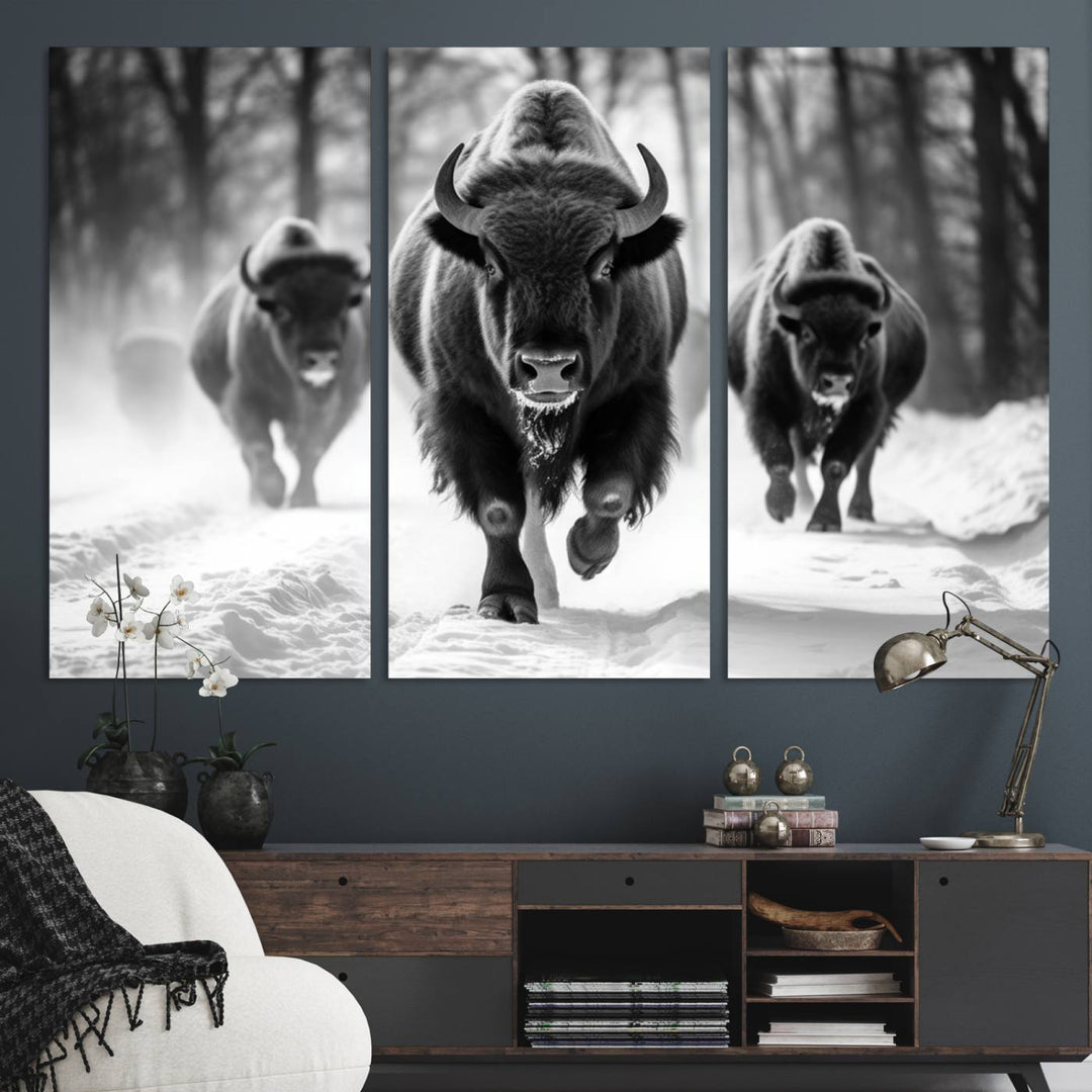 The Buffalo Wall Art Canvas Print of bison running through snow adorns the wall.