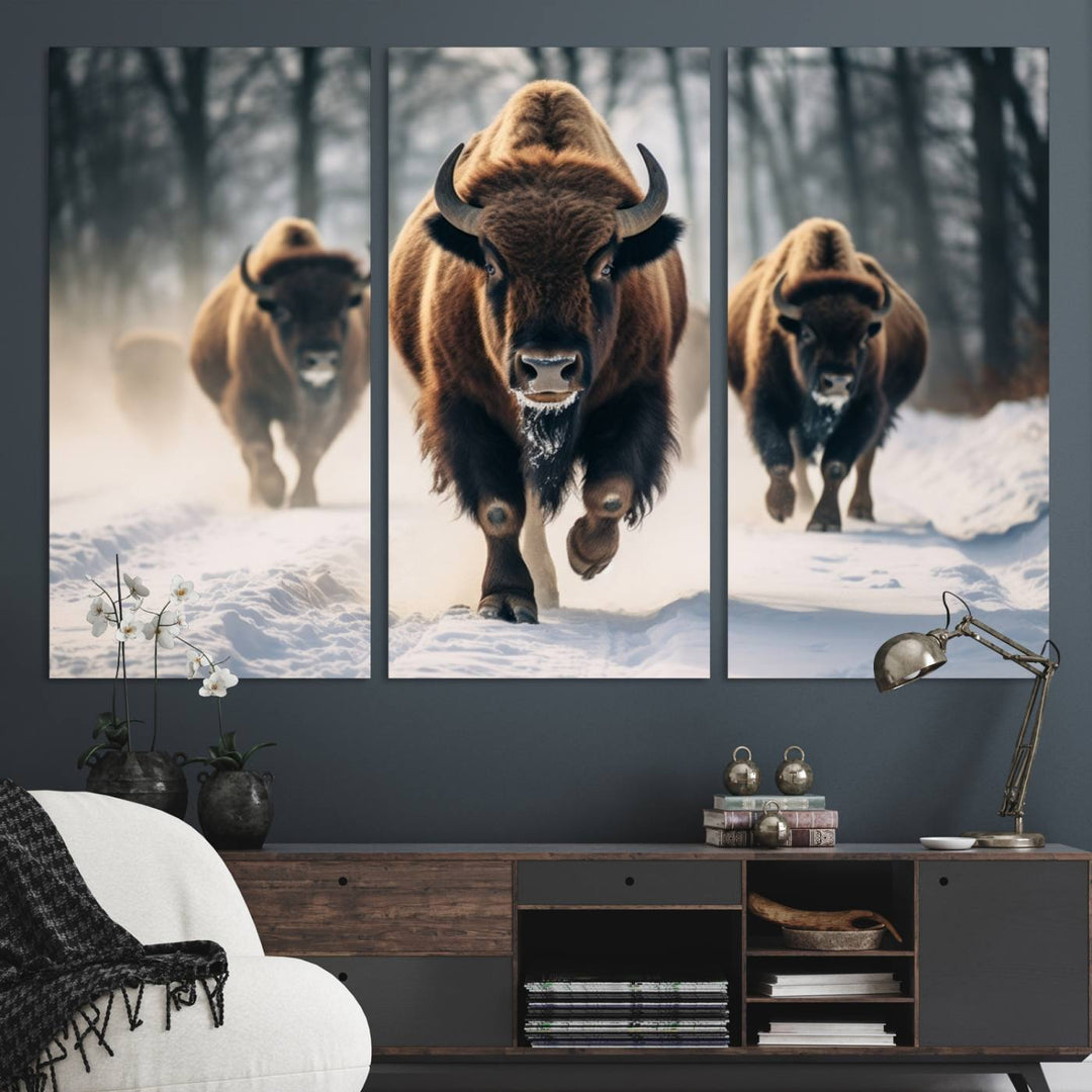 Wall art titled Cow Bighorn shows three bison running through snow in a forest.