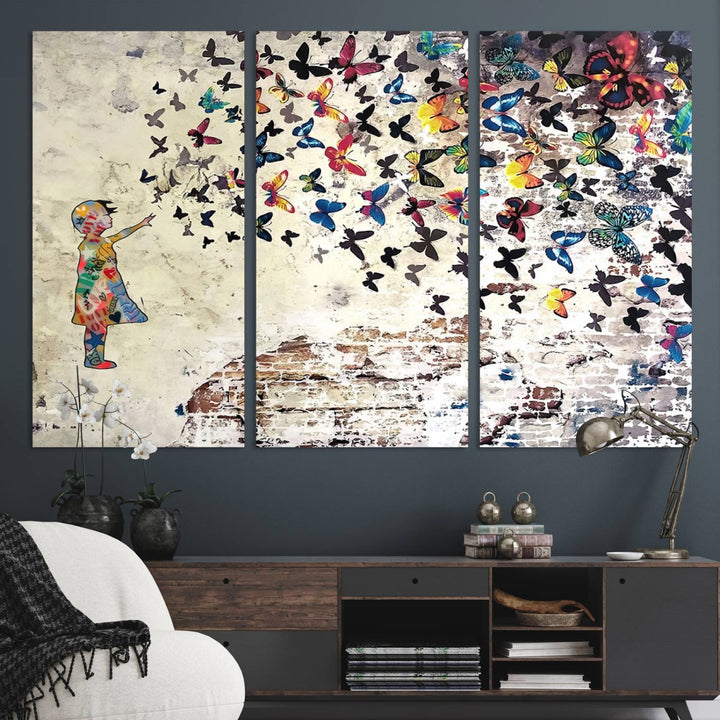 A Banksy Girl Butterfly Canvas Print is displayed on the textured wall.