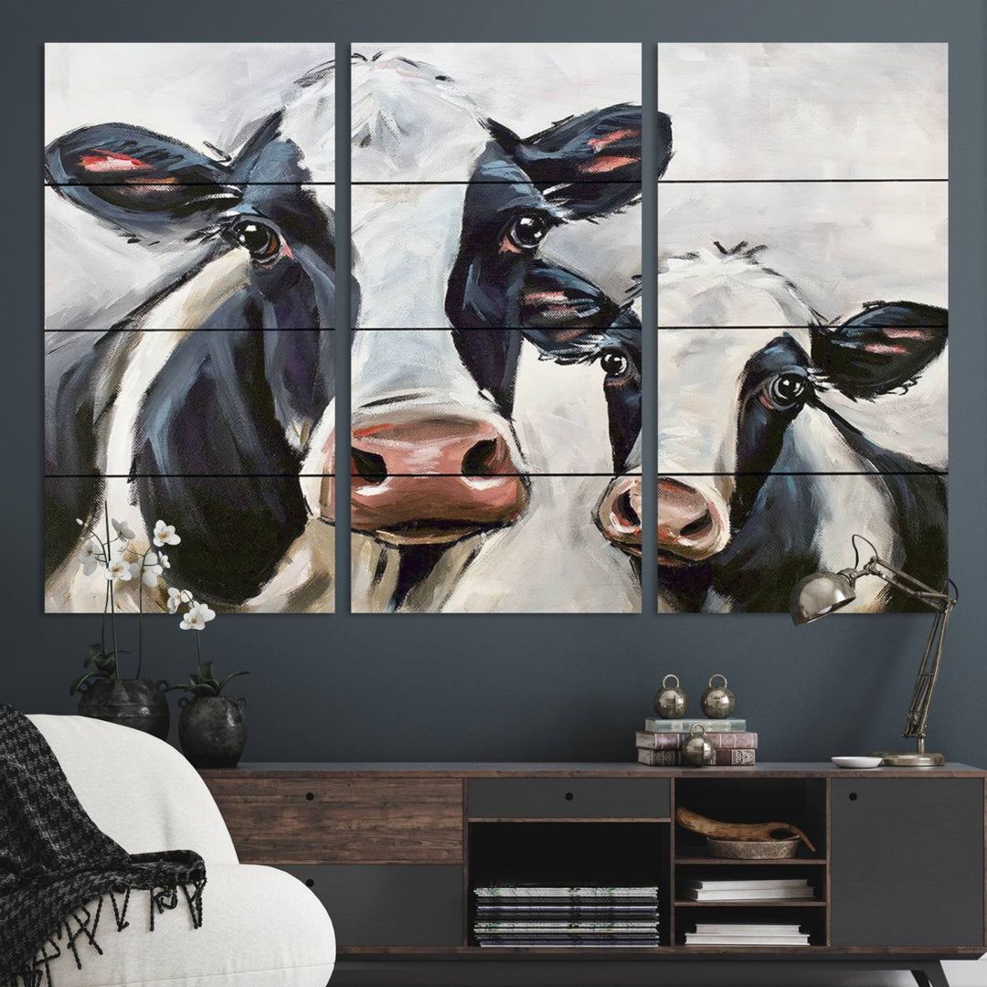 The Vintage Baby and Mom Cattle Canvas, featuring cows with black and white patches, is a prominent piece of wall art.