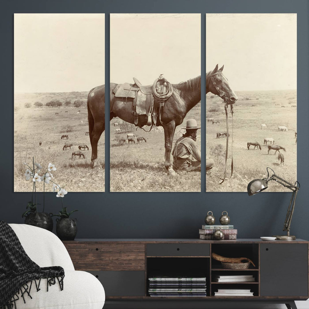 Cowboy Wall Art - Vintage Western Horse Canvas Print features a cowboy kneeling by his horse in a field.