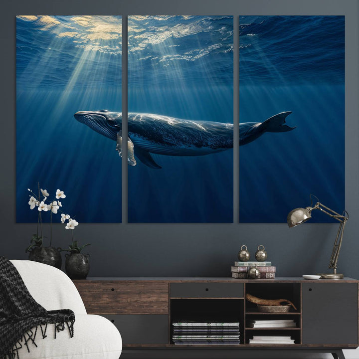 The Whale under Ocean wall art canvas print graces the white wall.