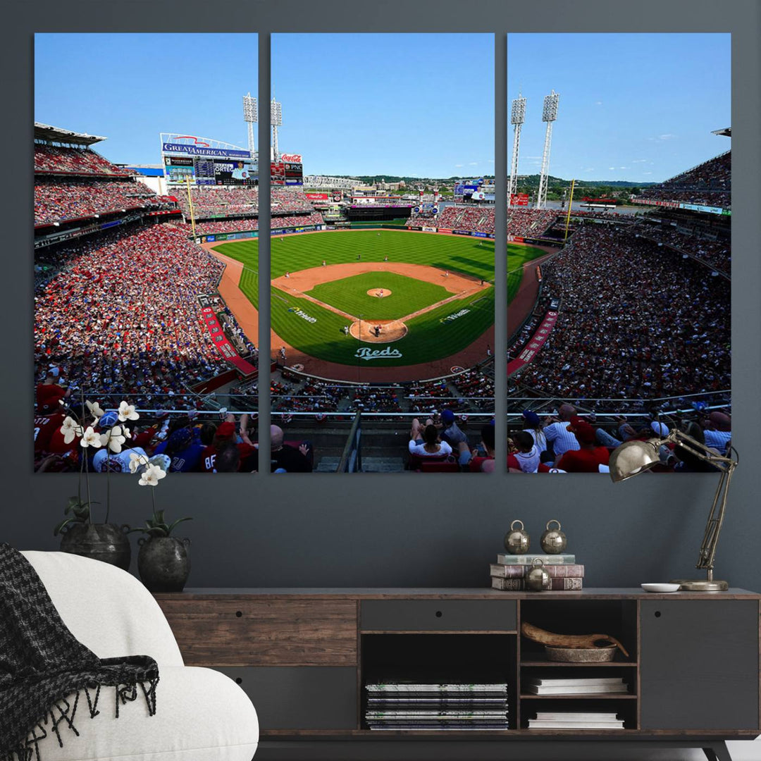 The Cincinnati Reds Baseball Team print of Great American Ball Park Stadium adorns the wall.