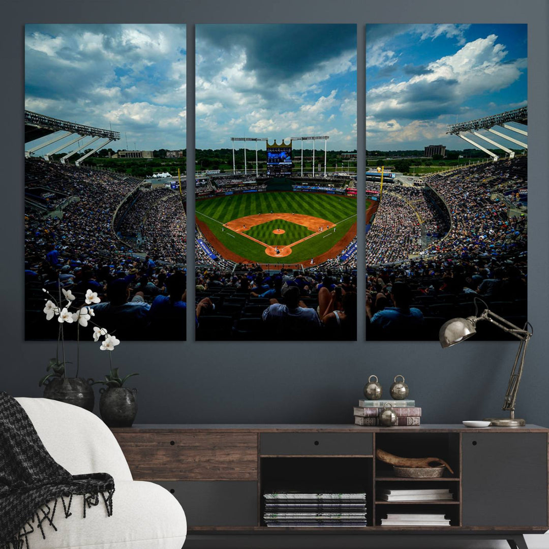 A 3-panel print of Kauffman Stadium, showcasing a crowded baseball field under cloudy skies.