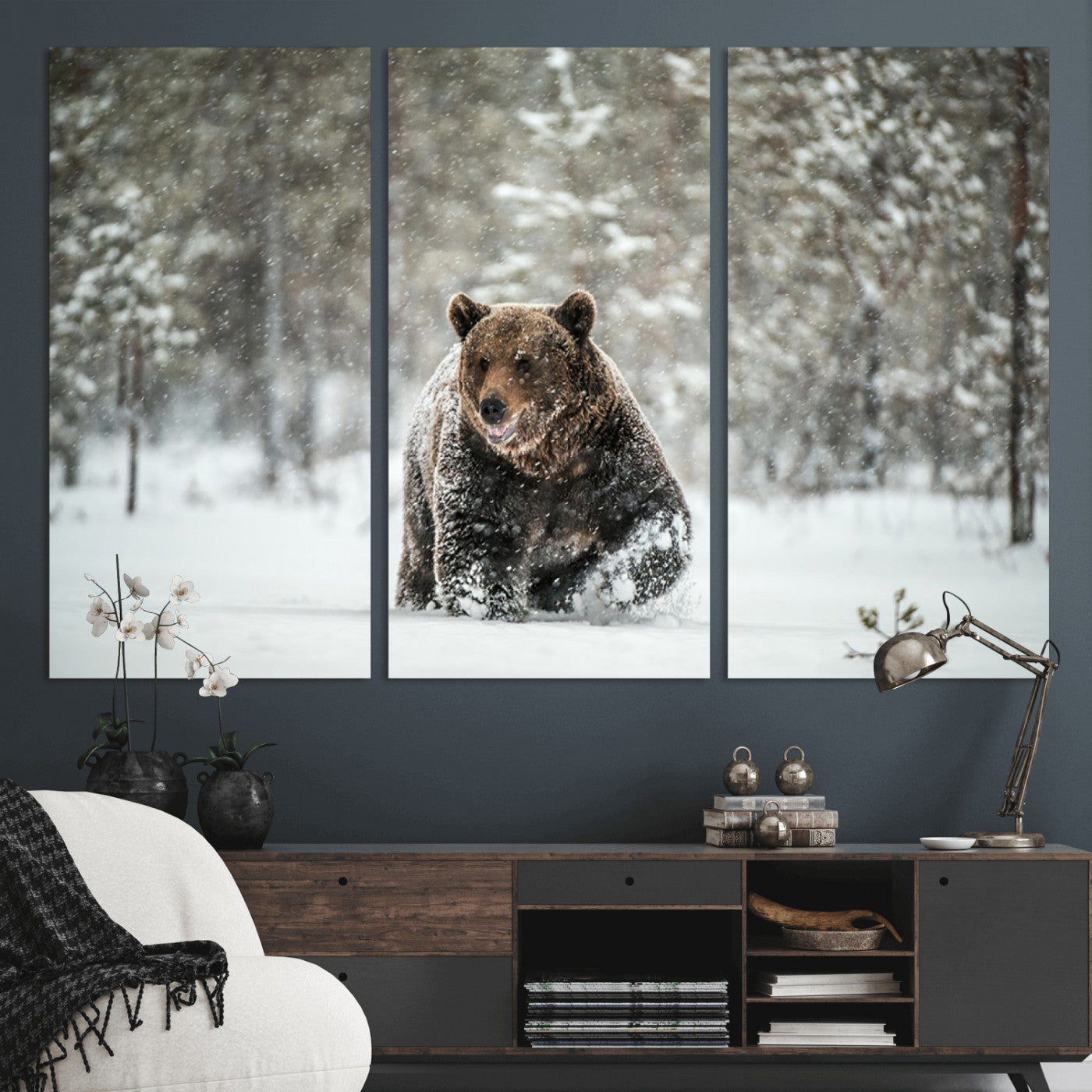 A majestic brown bear moves through a snowy forest landscape, surrounded by falling snowflakes, capturing the essence of wildlife in winter.