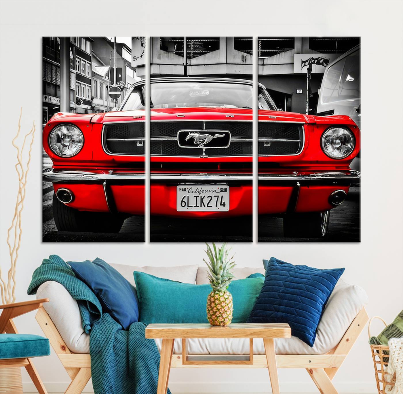 Front view of a bold red 1960s Ford Mustang parked in an urban environment, captured in dramatic contrast with a black-and-white city backdrop, emphasizing its timeless American muscle car identity.