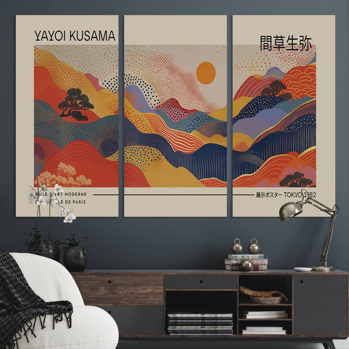 The Yayoi Kusama vibrant landscape canvas print featuring abstract mountains and a sun enhances the space with its modern aesthetic.