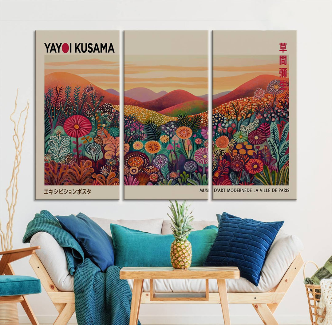 The room is adorned with a triptych artwork depicting colorful flowers and hills, incorporating the "Framed Yayoi Kusama 1986 Wall Art Print" – a vibrant abstract landscape canvas print that blends Japanese Wabi Sabi themes into contemporary nature-inspired décor.