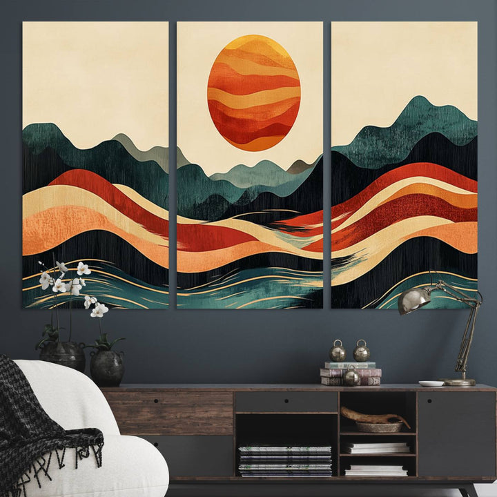 The Mountain Triptych wall art, featuring a design of the sun, mountains, and waves, is displayed prominently on the wall.