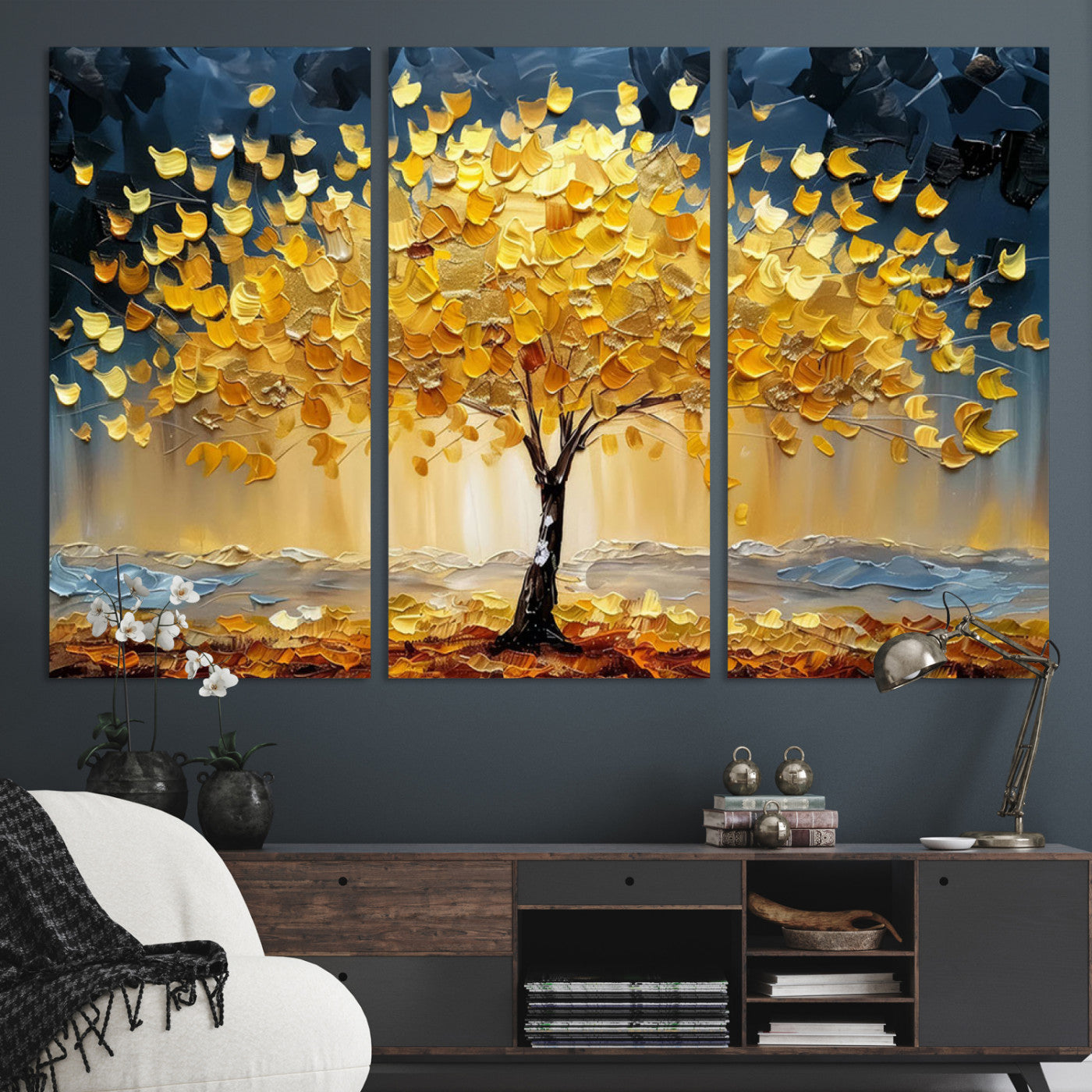 Canvas of a golden autumn tree with textured brushstrokes and moody blue skies, perfect for dramatic and vibrant home decor.
