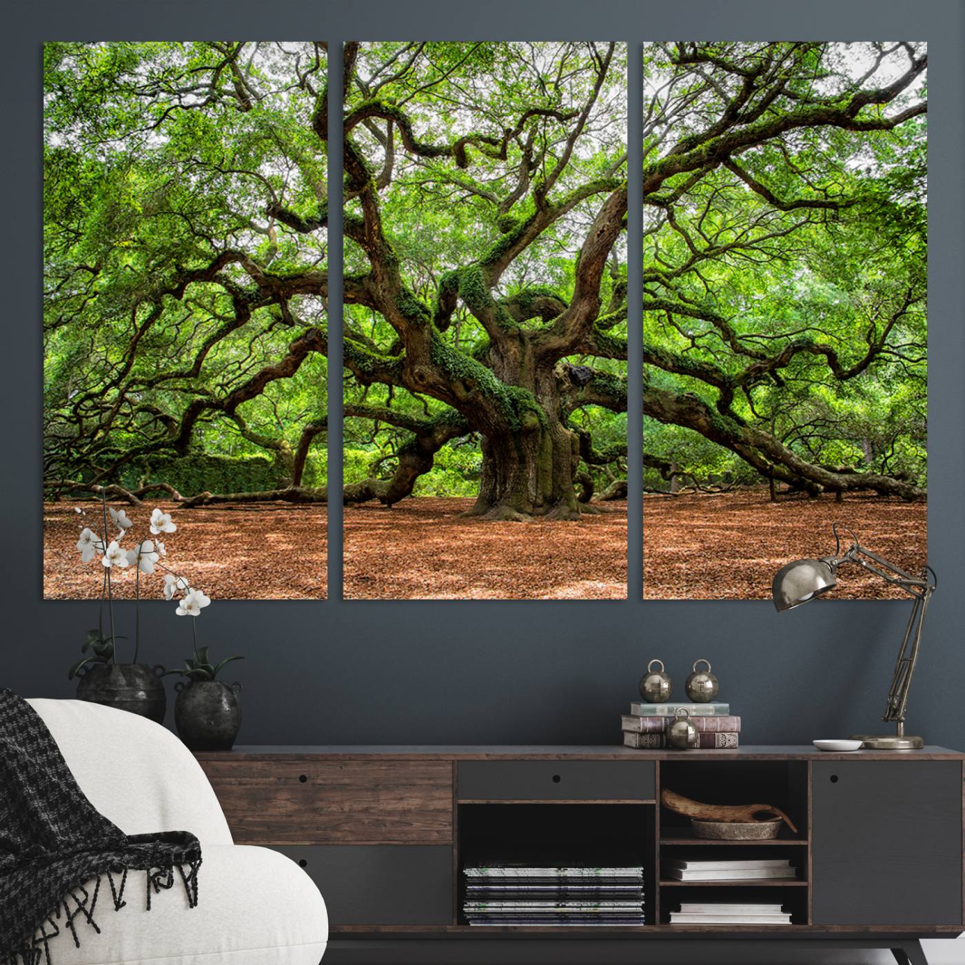 A majestic, ancient tree with expansive, twisting branches spreading wide under a dense, vibrant green canopy in a serene forest clearing.