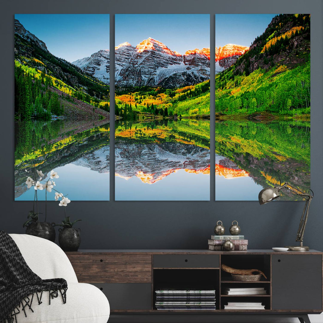 The Sunrise Maroon Bells Lake Wall Art Print beautifully captures North Maroon Peak mirrored in the tranquil lake, framed by lush greenery.