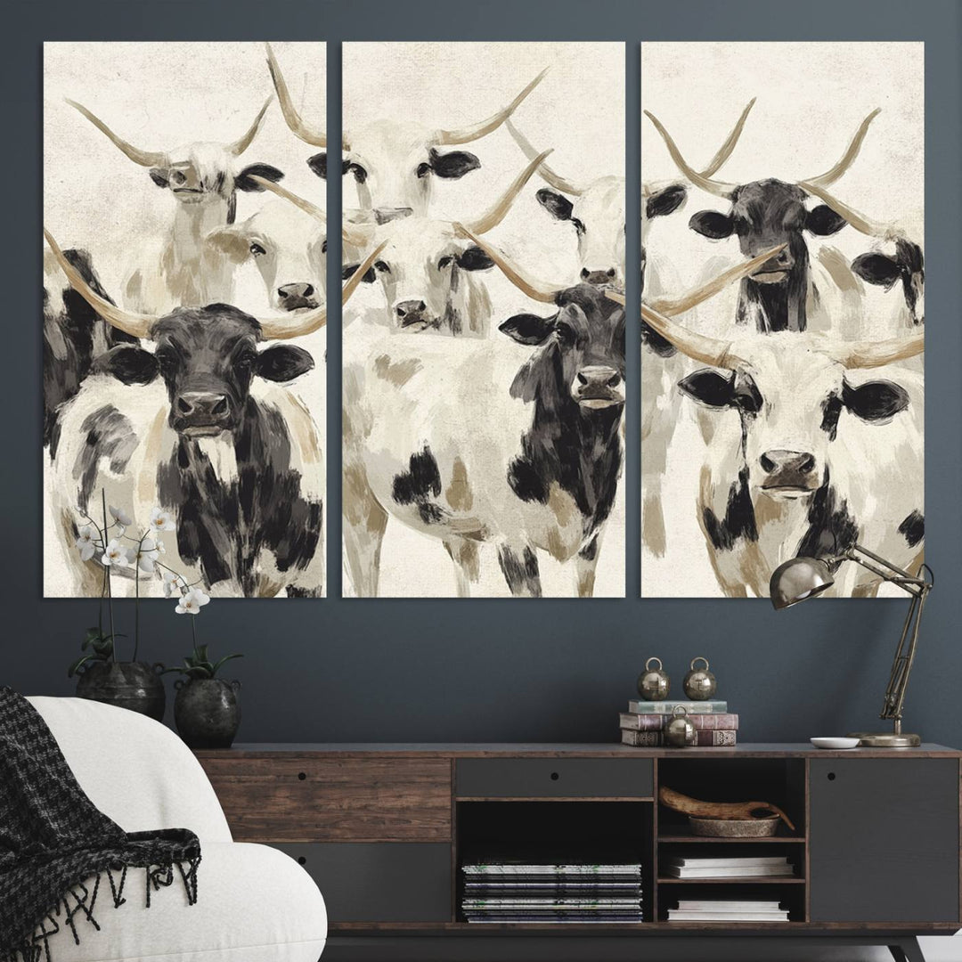 Canvas print titled Longhorn Texas Cow Drawing, depicting longhorn cattle with black and white markings, made in the USA, displayed on the wall.