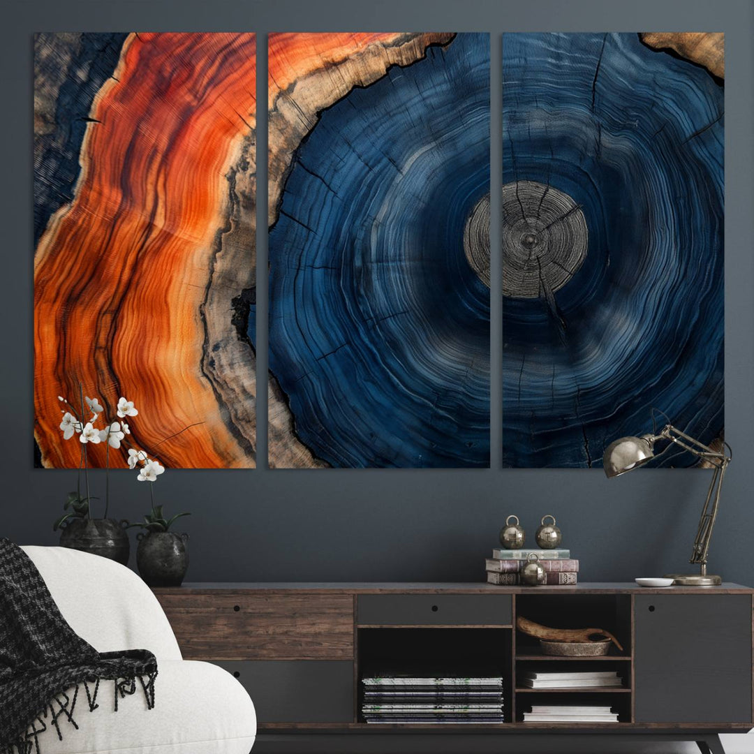 Abstract Tree Ring Wall Art Print on canvas featuring vibrant blue, orange, and brown rings with a natural rustic wood texture. Free shipping available!.