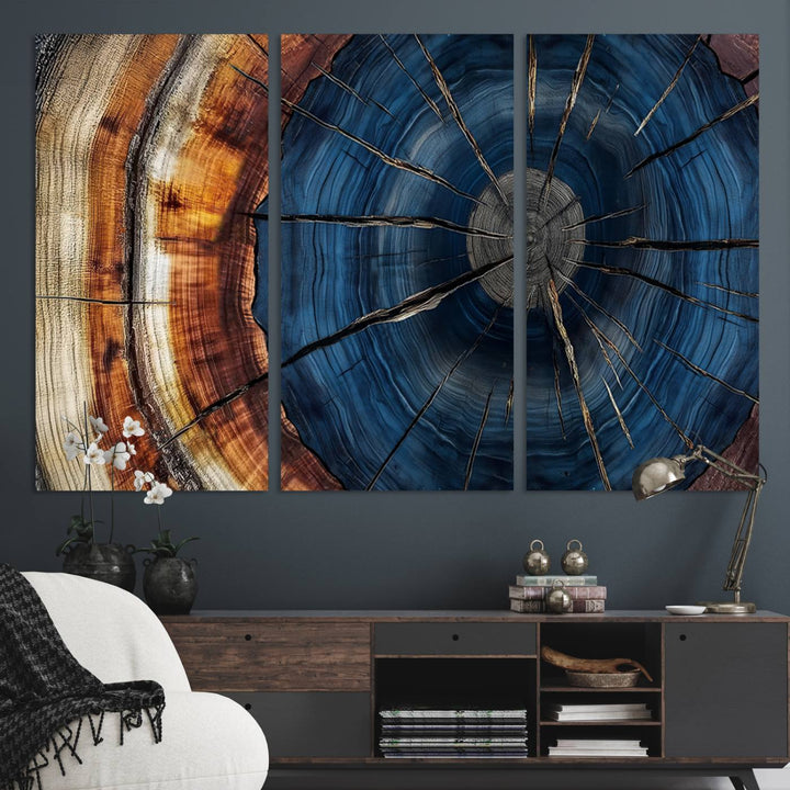 The Abstract Tree Rings Canvas Print features blue, brown, and orange rings that highlight wood grain and natures beauty.