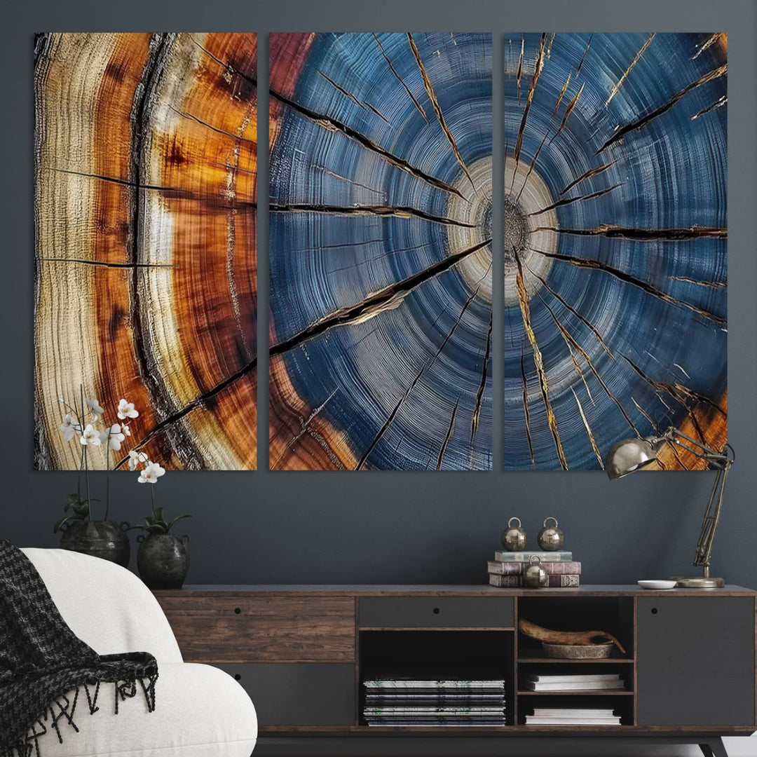 Close-up of blue, brown, and orange wood grain rings on the Abstract Tree Rings Canvas Wall Art Print.