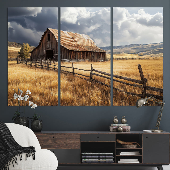 Canvas of a weathered wooden barn in a golden field under a dramatic sky, perfect for rustic or farmhouse-style wall decor.