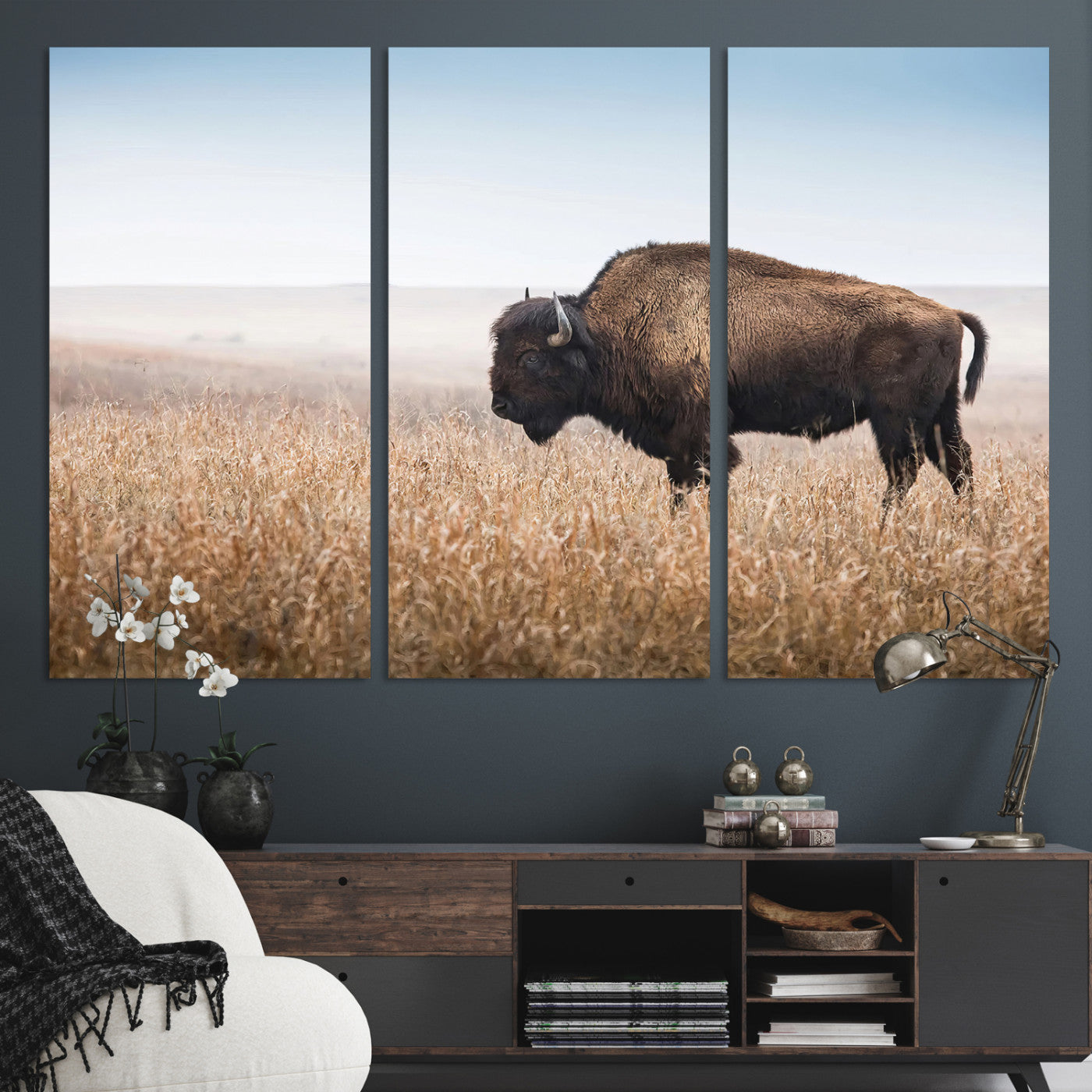 A solitary American bison stands in a dry grassland under soft skies, ideal for rustic or western-style home decor in warm neutral tones.