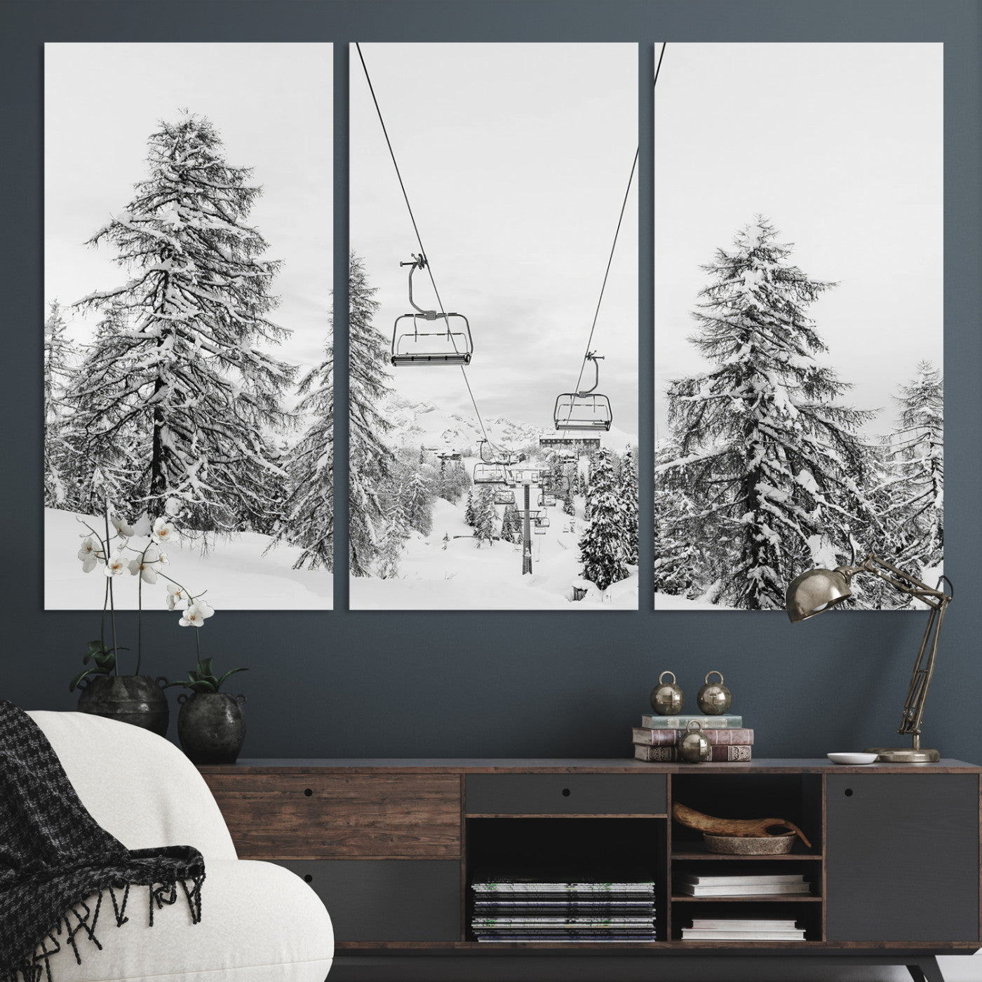 Black and white image of a ski lift amidst snow-covered pine trees, ideal for winter mountain or cabin-themed decor.