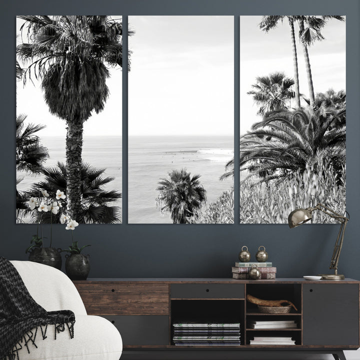 Monochrome canvas of palm trees framing a coastal surf scene, perfect for California-inspired or retro black-and-white beach decor.