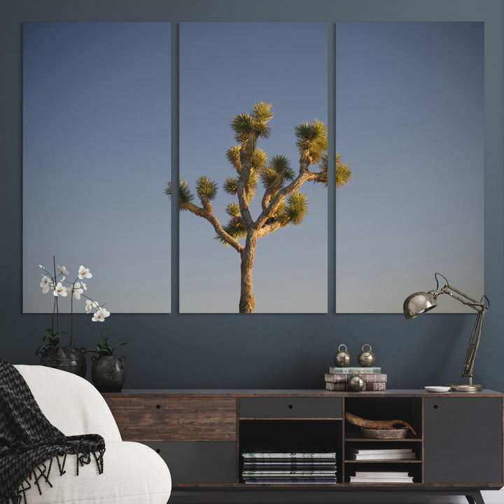 A lone Joshua Tree standing against a deep blue sky, capturing the serene and rugged beauty of the Southwestern desert landscape.