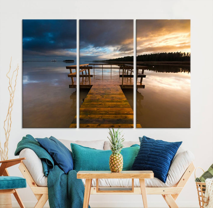 The "Serene Lake Pier at Sunset" landscape canvas print, crafted as ready-to-hang and framed wall art, enriches the contemporary setting by capturing the tranquility of a lakeside pier at sunset.