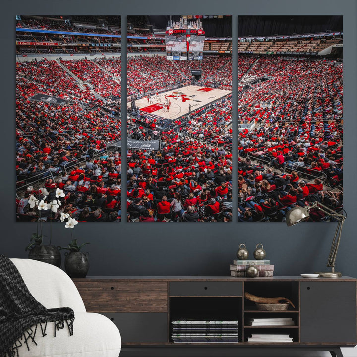 A painting of Louisville Cardinals fans in red at the KFC Yum Center Arena.