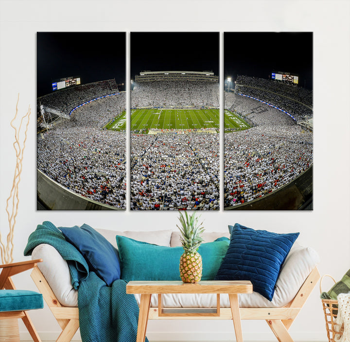 The Beaver Stadium Night Game Triple Canvas Wall Art - Penn State Nittany Lions Football Match features a panoramic view of a packed Beaver Stadium at night.