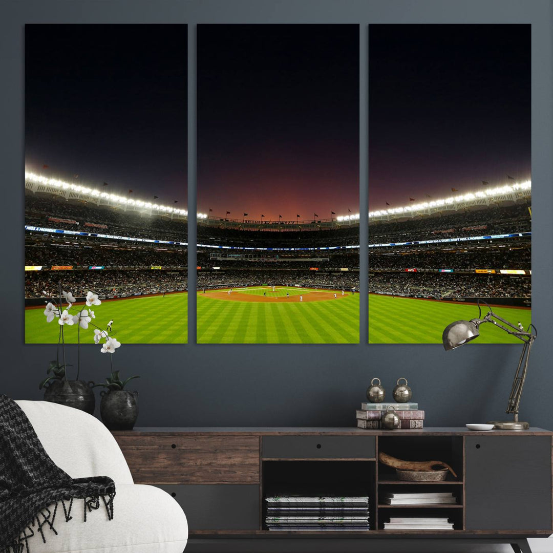 A night game at Yankee Stadium depicted on canvas beneath a sunset sky.