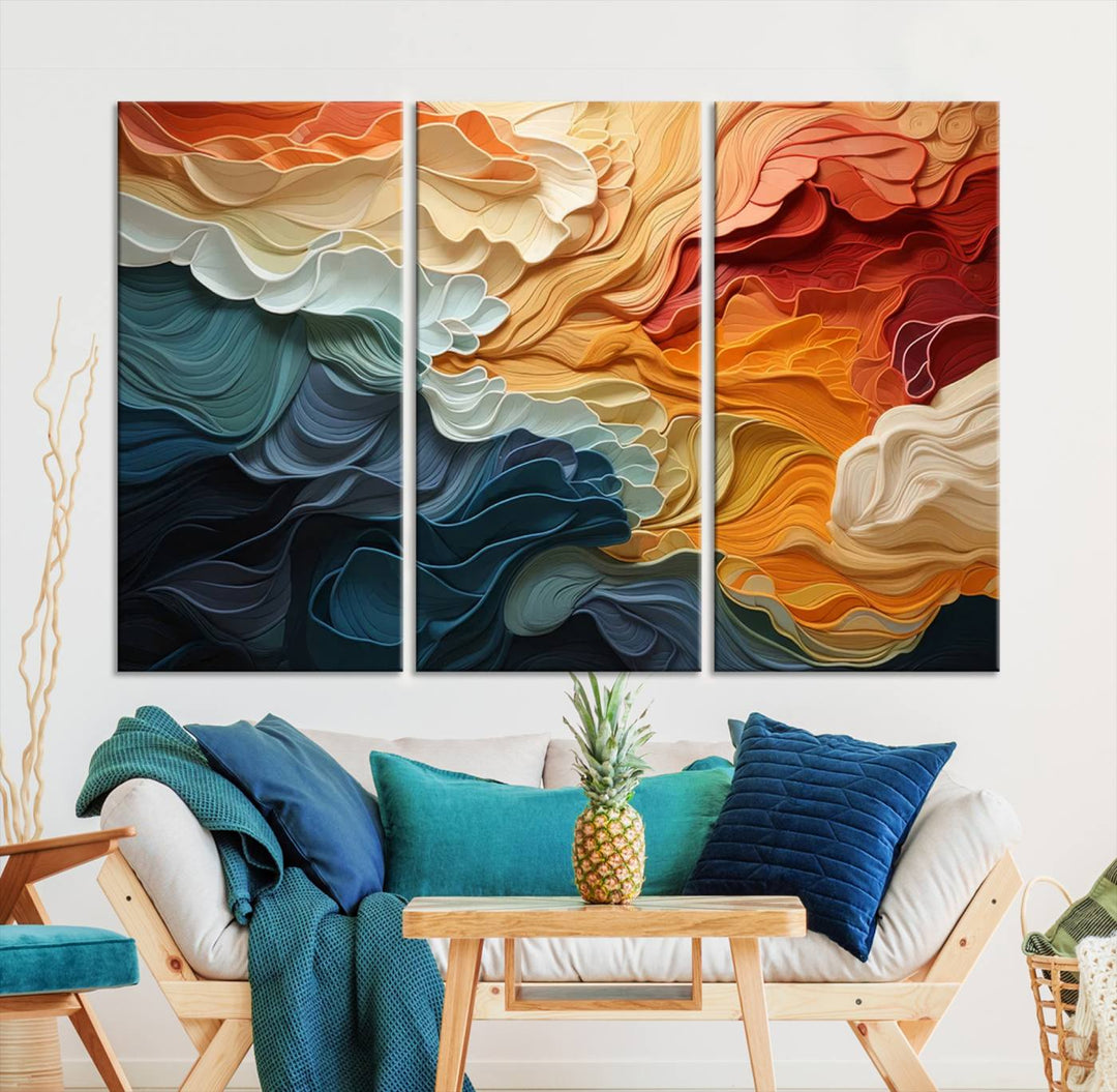 A Blue Orange Abstract Wave Wall Art Canvas Print adorns the wall. This colorful masterpiece is professionally hand-assembled to enhance any space.