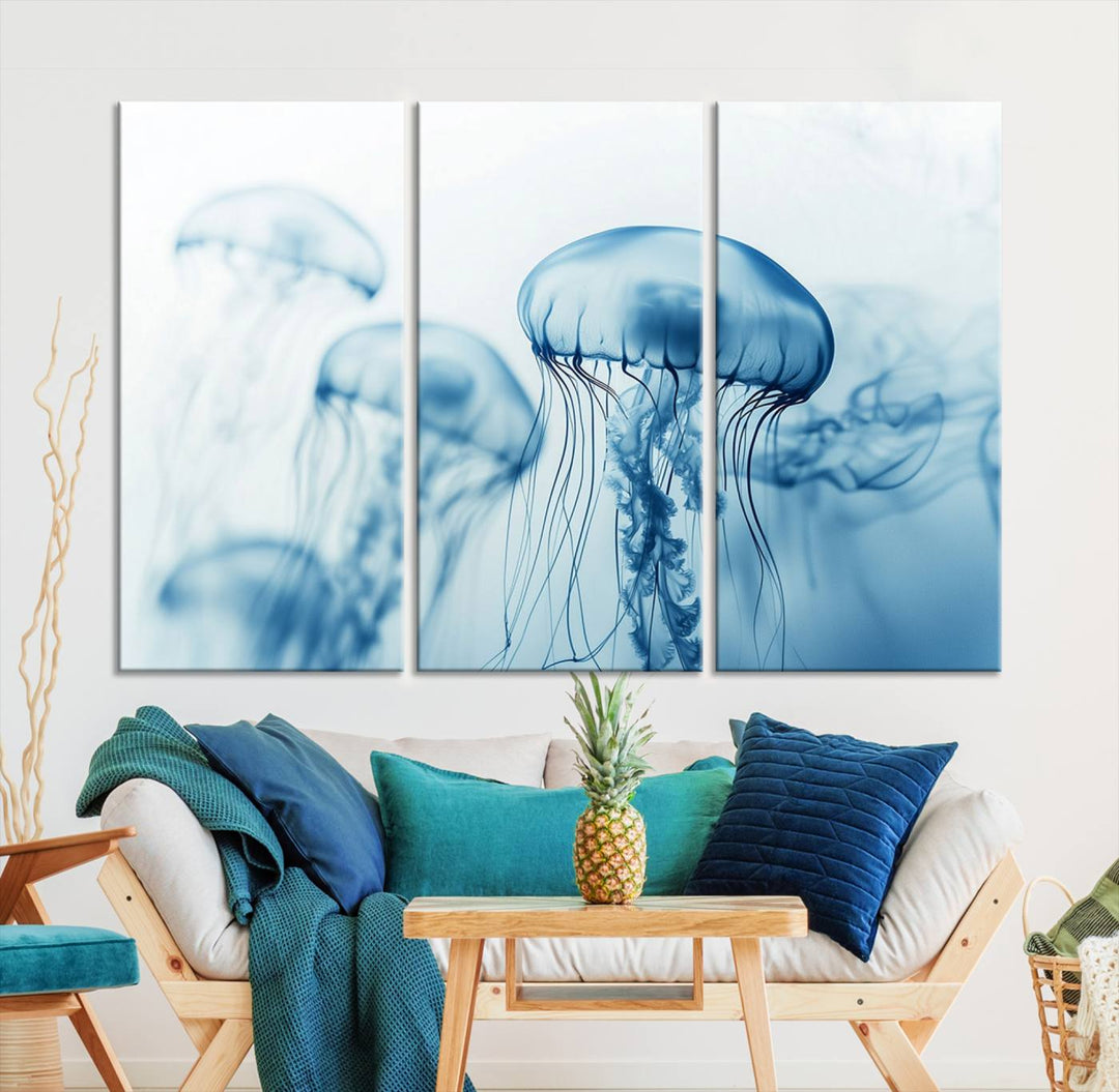 A breathtaking triptych of the Blue Jellyfish Wall Art Canvas Print decorates the space, beautifully highlighted by an overhead lamp. Each canvas is created on museum-quality material using high-resolution printing and includes a UV-protective coating to ensure long-lasting vibrancy.