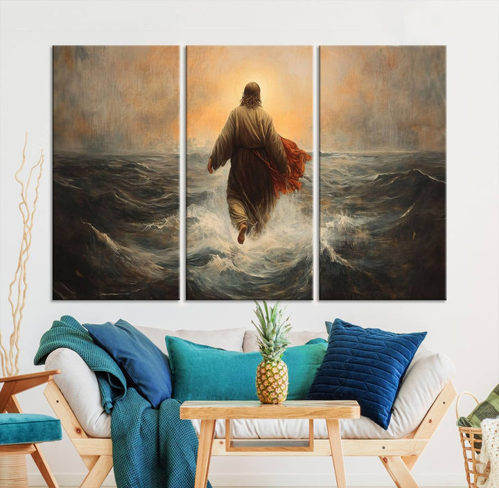 A modern living room is adorned with a triptych titled "Jesus Walking on Water, Christian Wall Art, Jesus Christ Walking on Oil Painting Style Print." The artwork, presented on museum-quality canvas, showcases vibrant colors and exquisite detail.