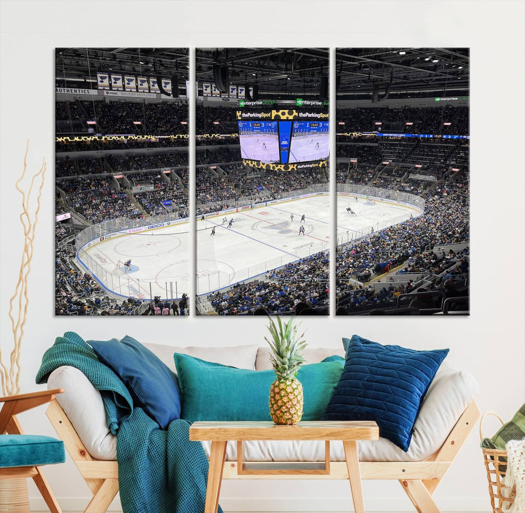 A large Enterprise Center canvas of a crowded hockey arena hangs prominently.